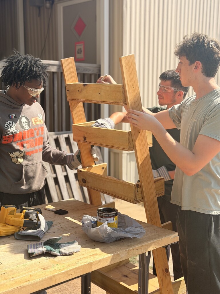 students sanding and staining