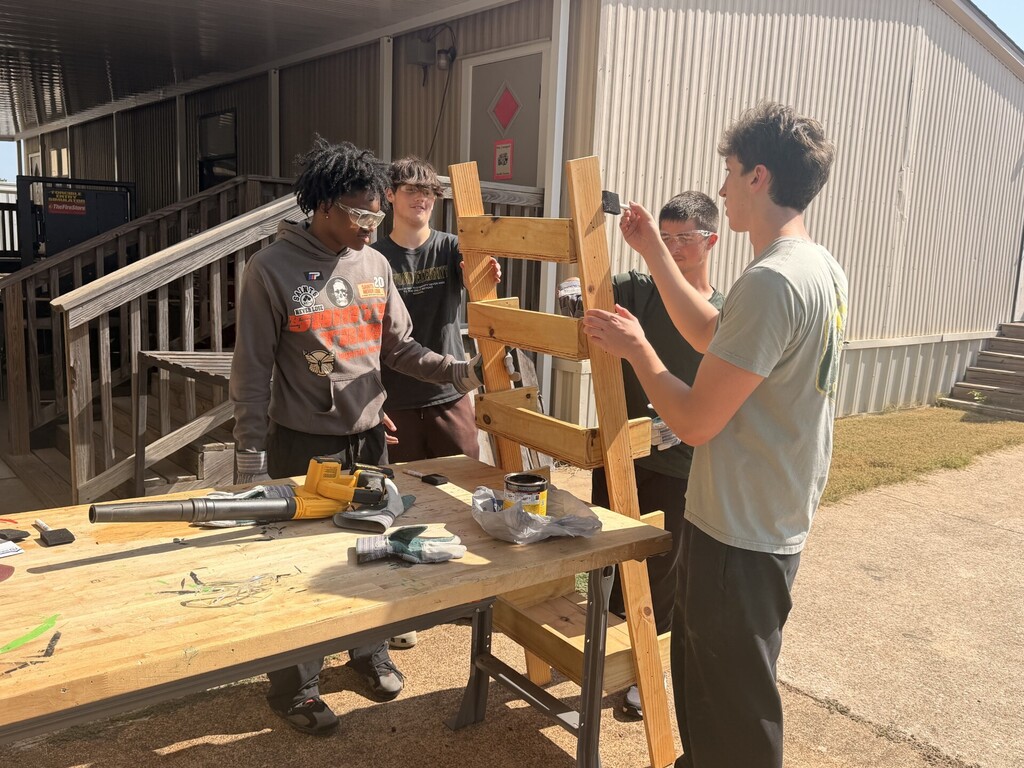 students sanding and staining