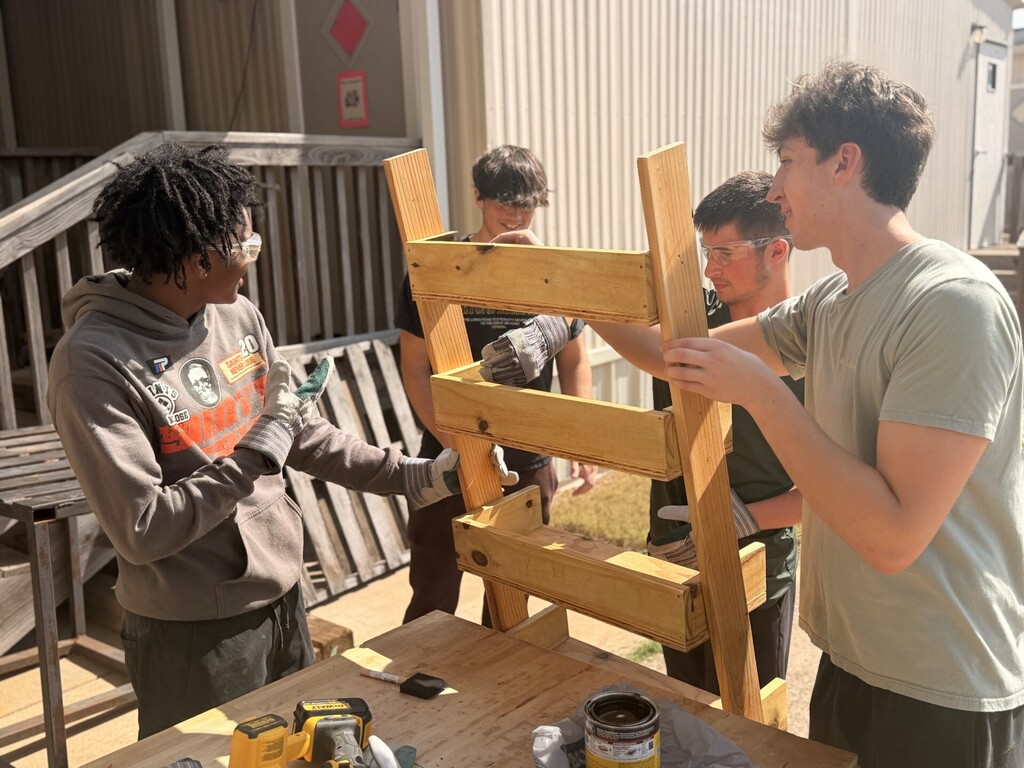 students sanding and staining