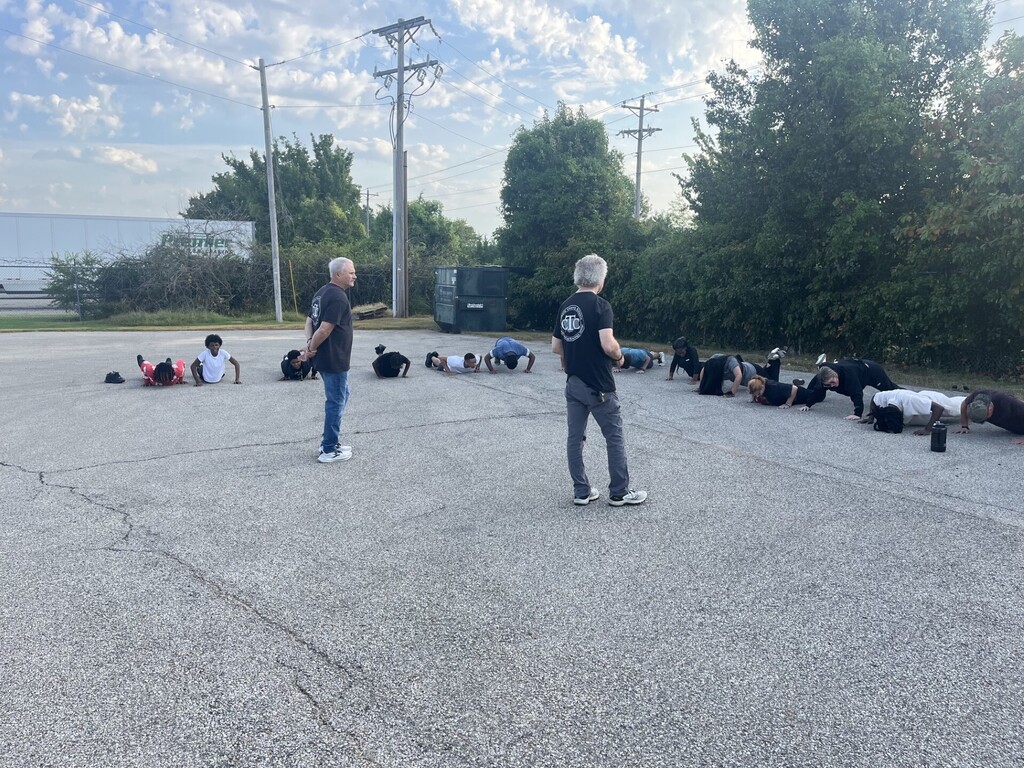 teachers instructing students to do pushups