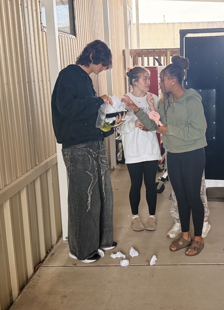 students unpacking their egg