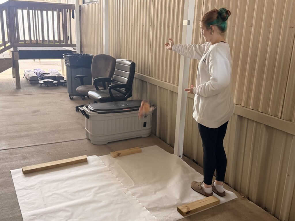 student dropping package with egg inside