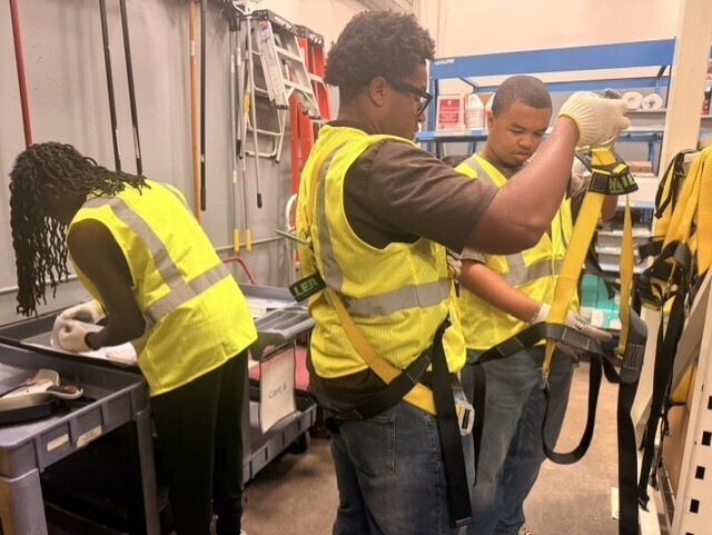 students figuring out safety belts