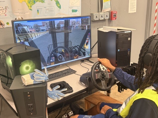 student practicing driving simulator