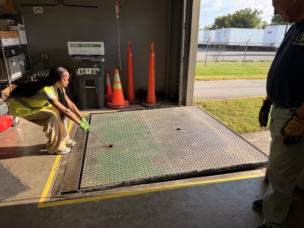 student raising dock leveler
