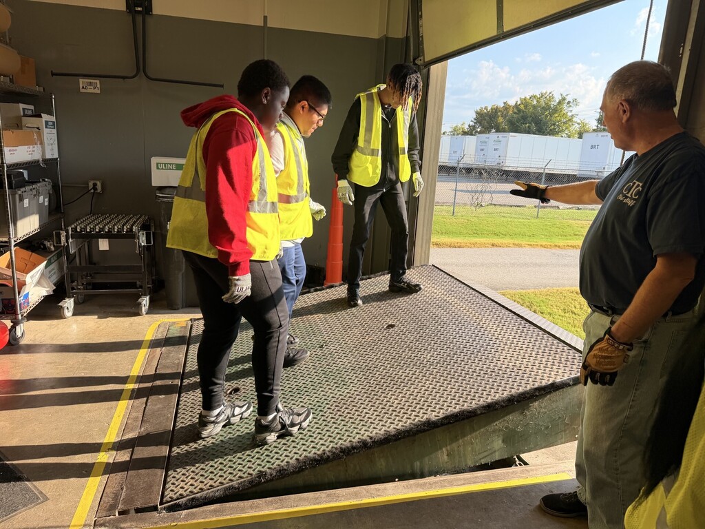 student raising dock leveler