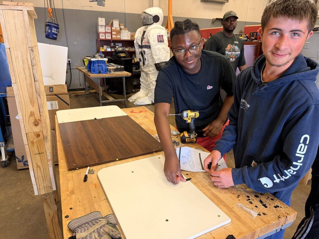 2 students at a work bench