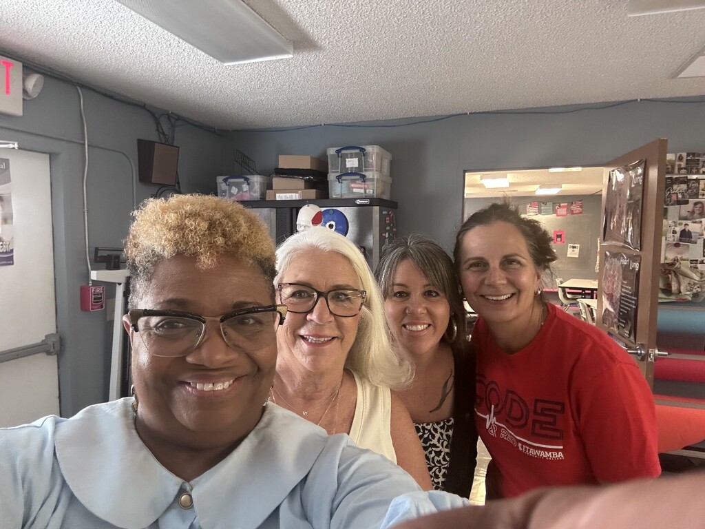 four women posing for a picture