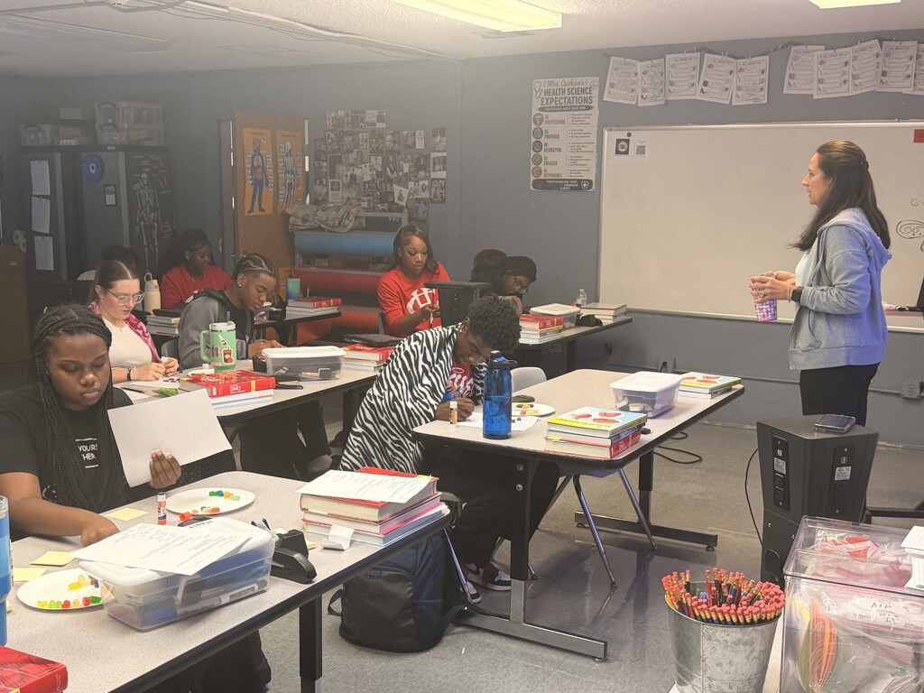 teacher standing in class teaching
