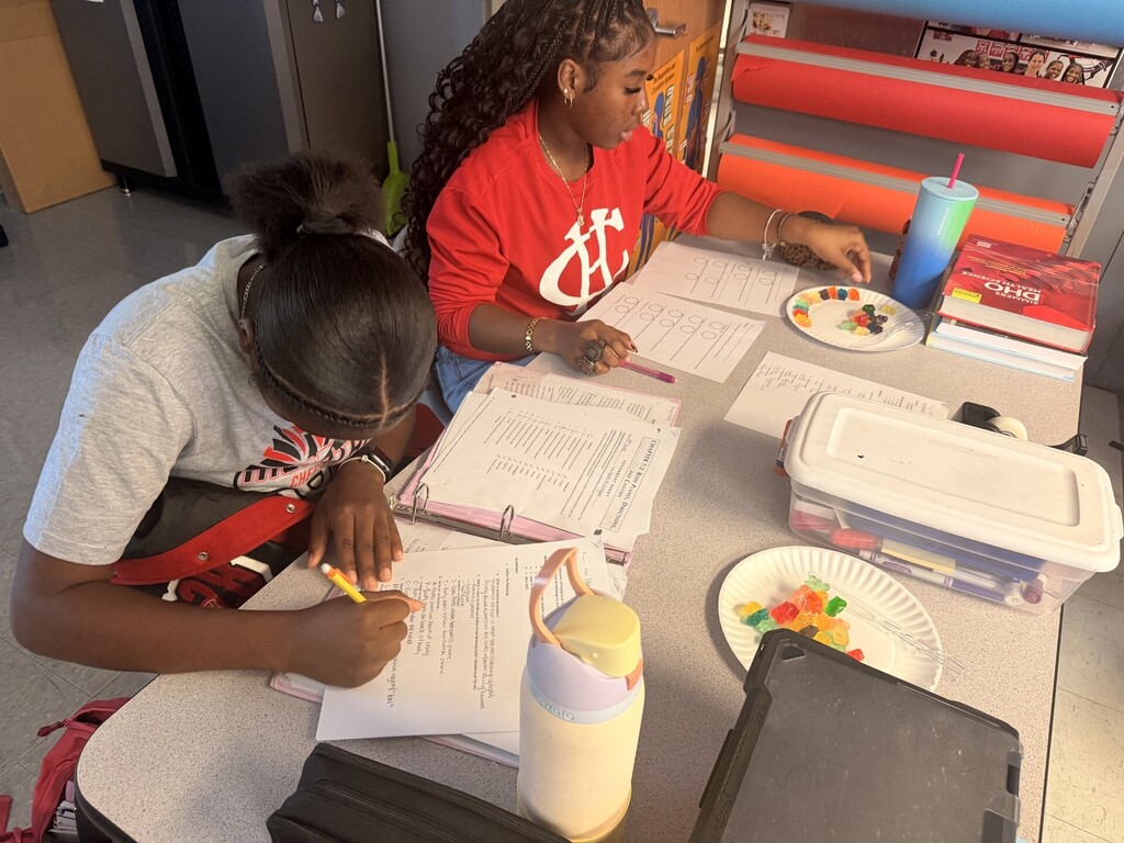 students cutting up gummy bears
