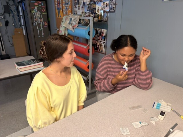 students practicing taking vitals