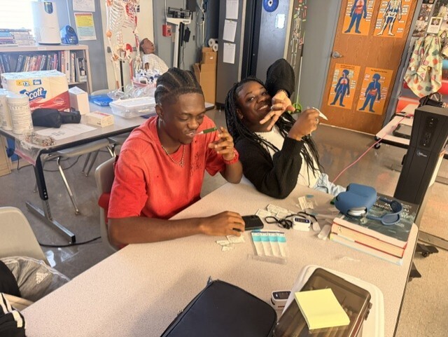 students practicing taking vitals