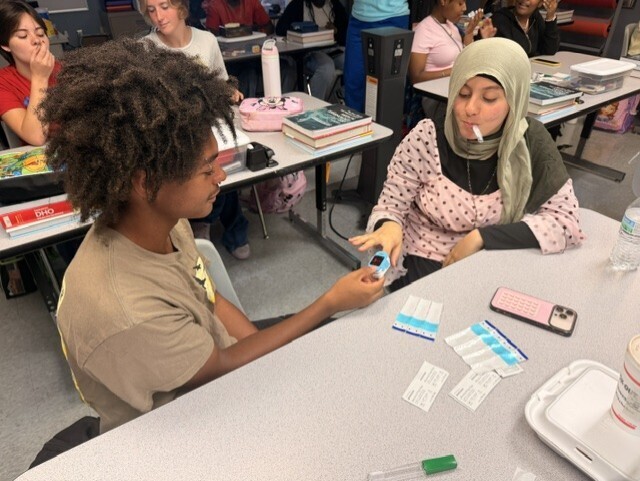 students practicing taking vitals
