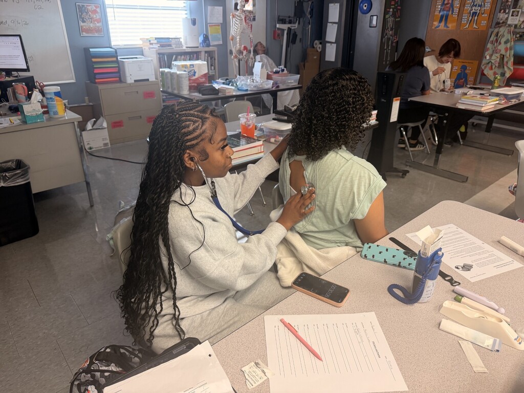 students practicing taking vitals