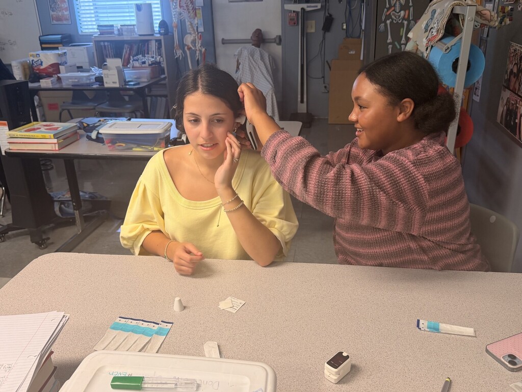 students practicing taking vitals