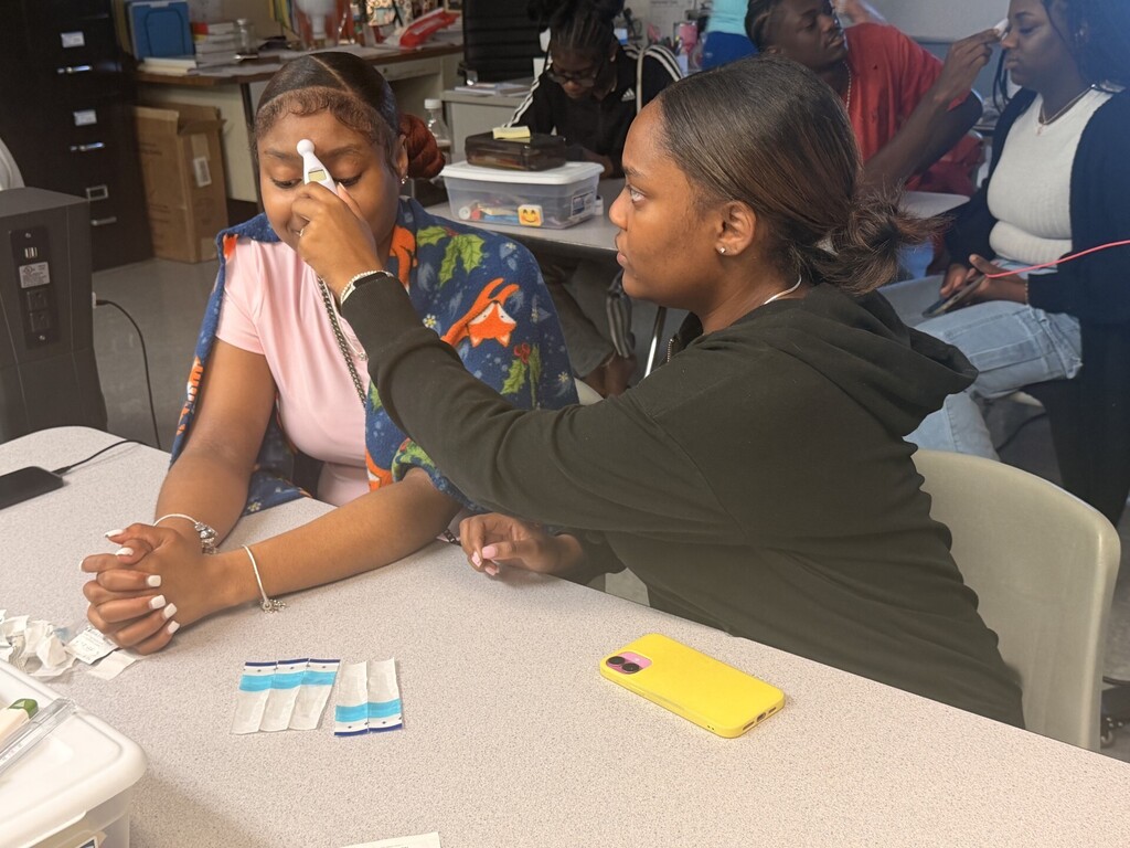 students practicing taking vitals