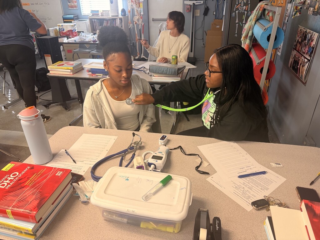 students practicing taking vitals