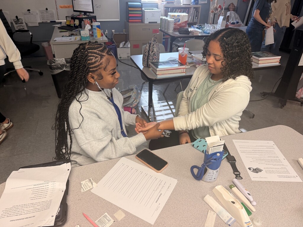 students practicing taking vitals