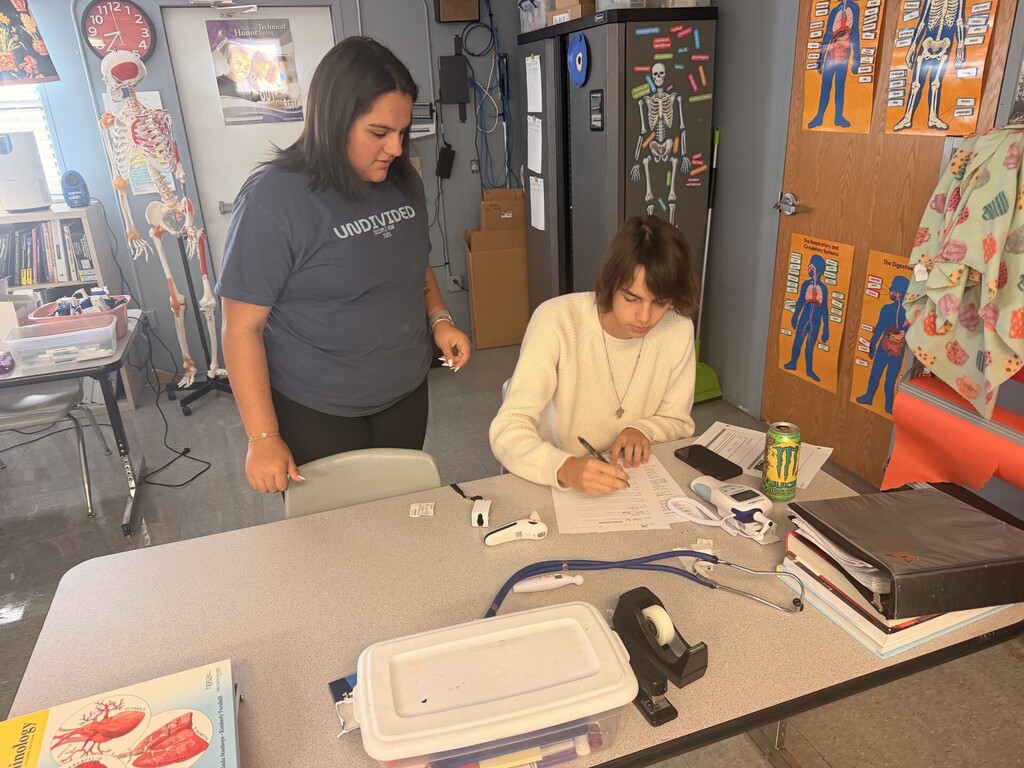 students practicing taking vitals