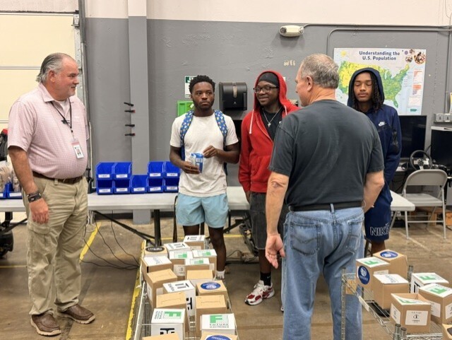students talking to teacher and quest speaker