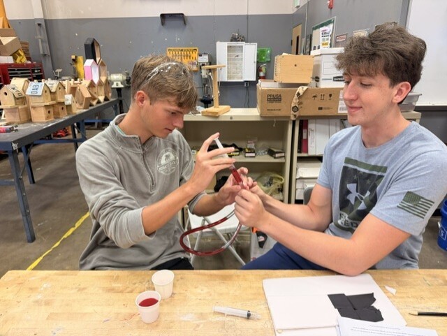 students creating hydraulic car lift