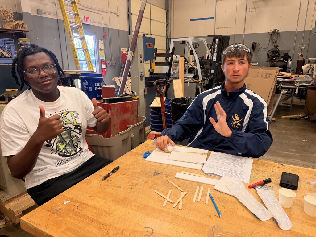 students creating hydraulic car lift