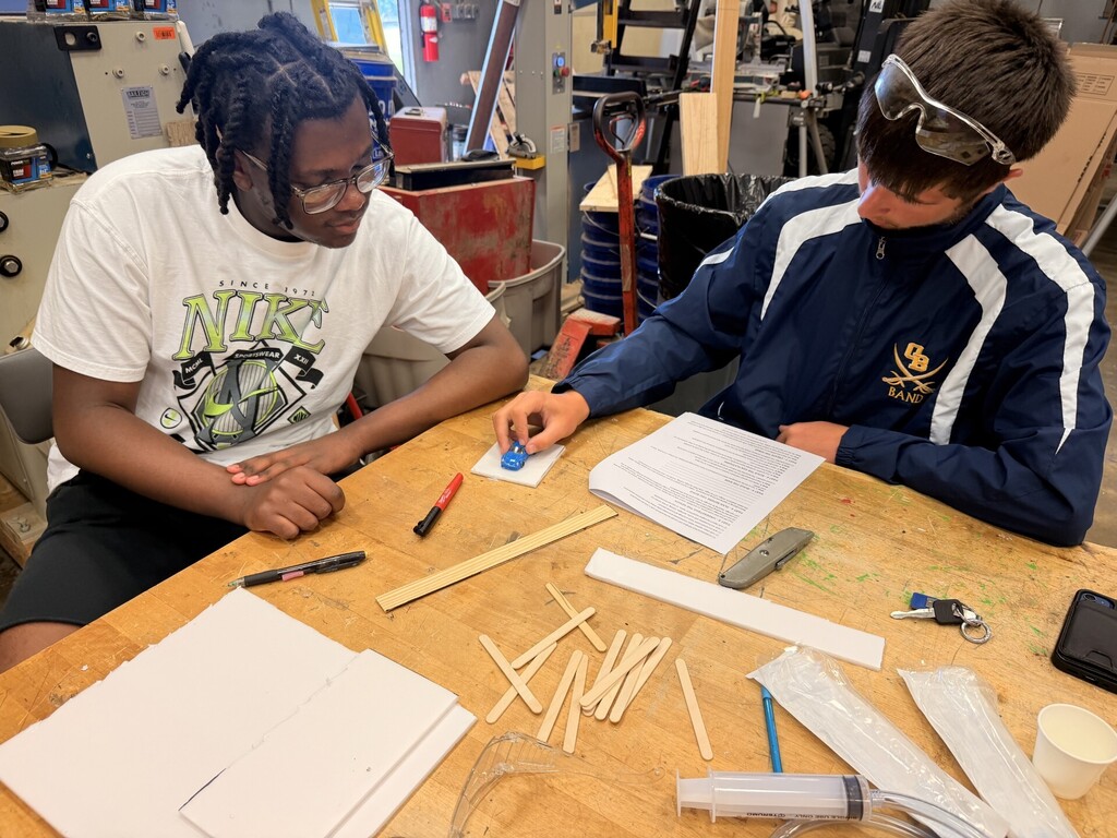 students creating hydraulic car lift