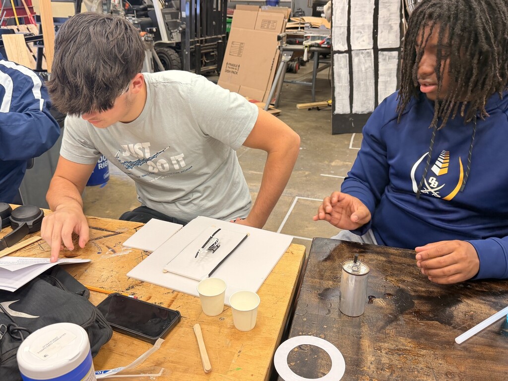 students creating hydraulic car lift
