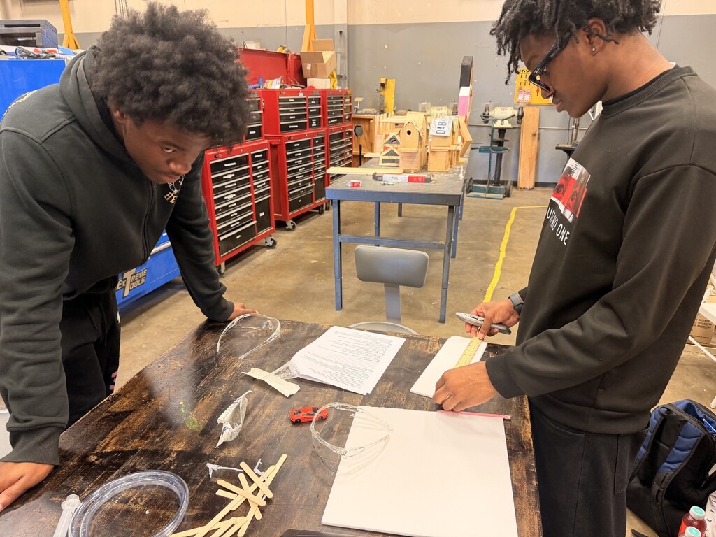students creating hydraulic car lift