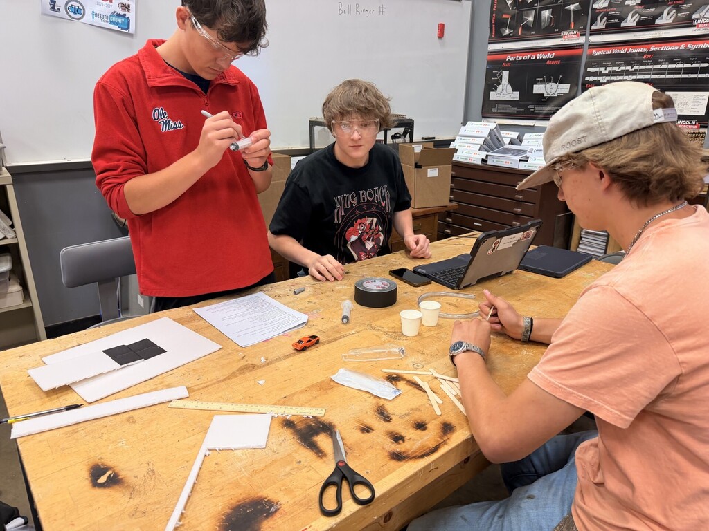 students creating hydraulic car lift