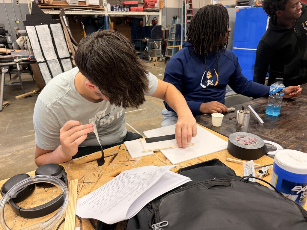 students creating hydraulic car lift