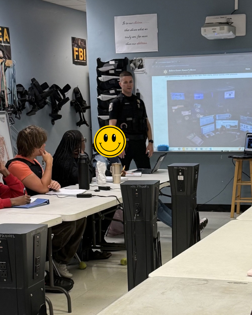 officer talking to students