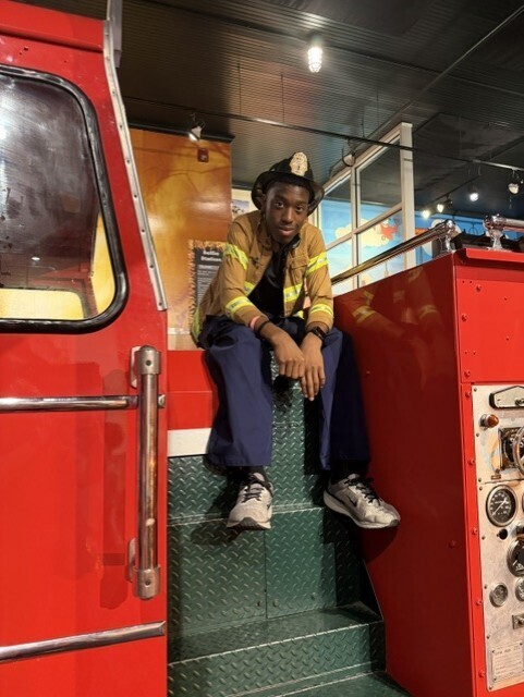 student on fire truck