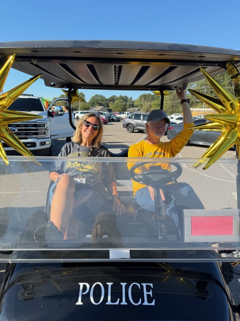 staff members on golf cart
