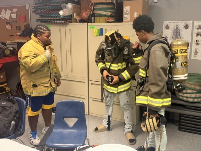 students with fire gear on