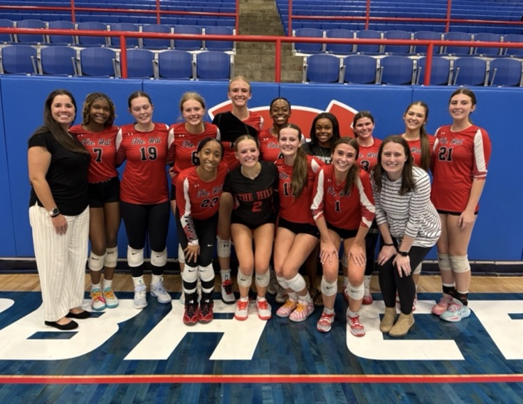 Image shows the Center Hill High School volleyball team and their coaches after winning the State of Mississippi North Half game.