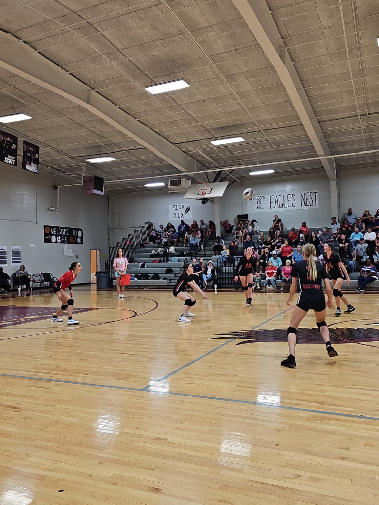 Image shows the Center Hill Middle School volleyball team playing on a basketball court.