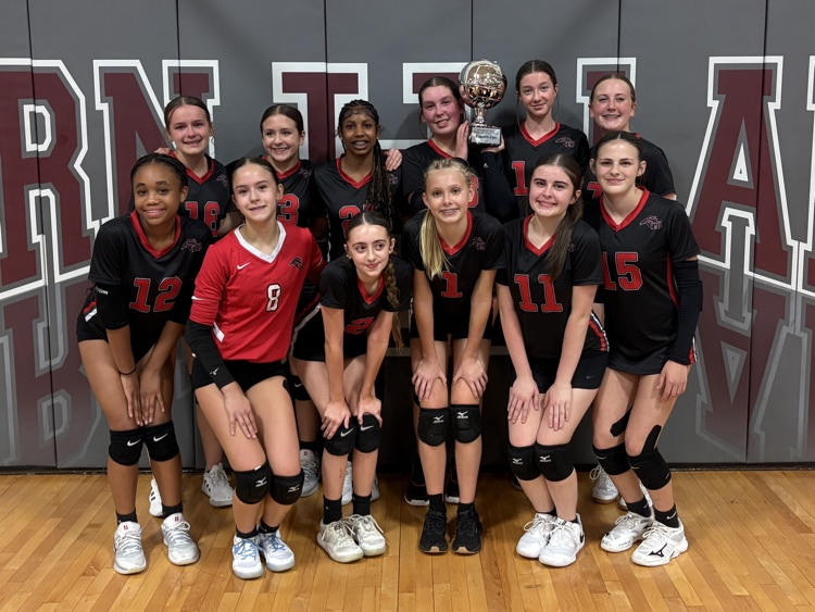 Image shows the Center Hill Middle volleyball team photo holding a second place trophy.