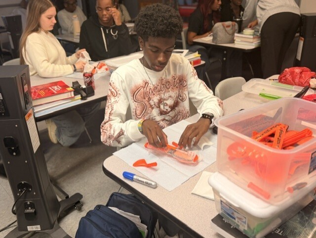 student practicing sterile wrapping