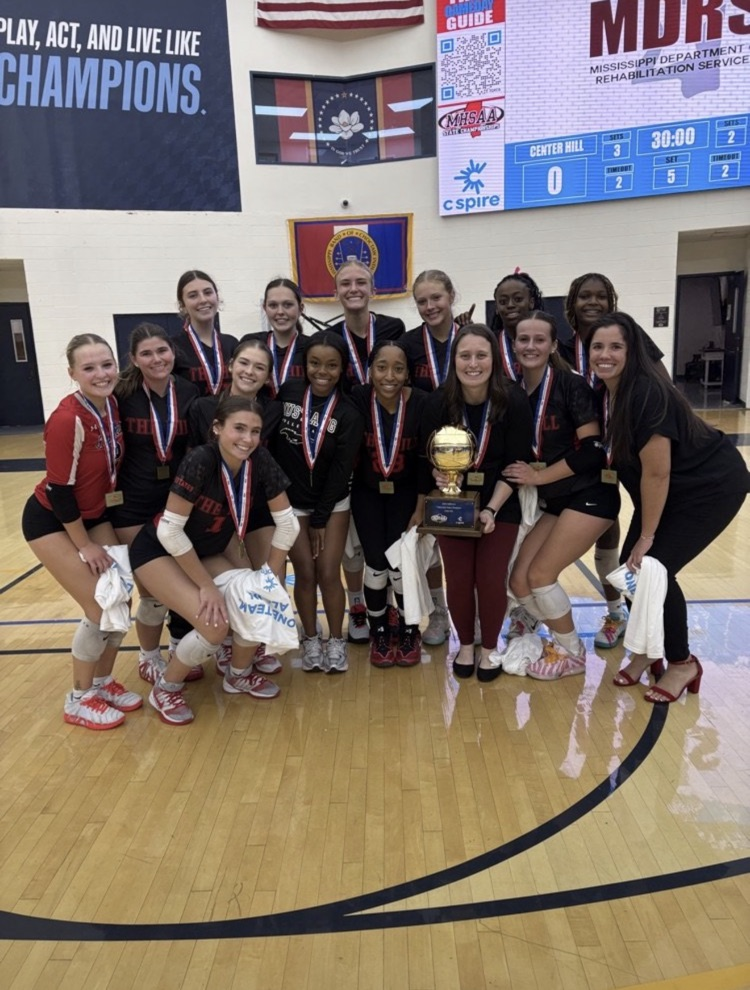 Image shows the Center Hill High School Volleyball team with their MHSAA State Championship trophy.