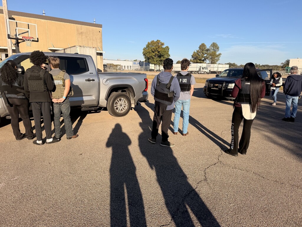 students outside practicing traffic stops