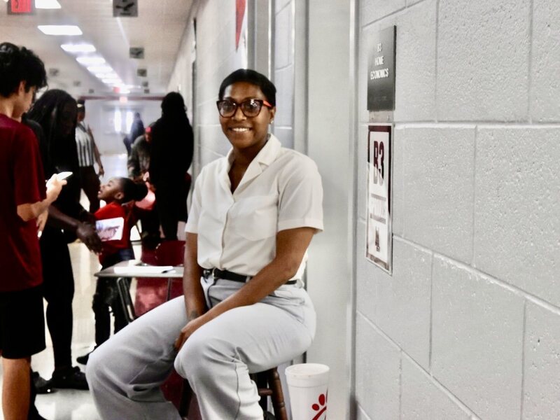 Teacher smiles