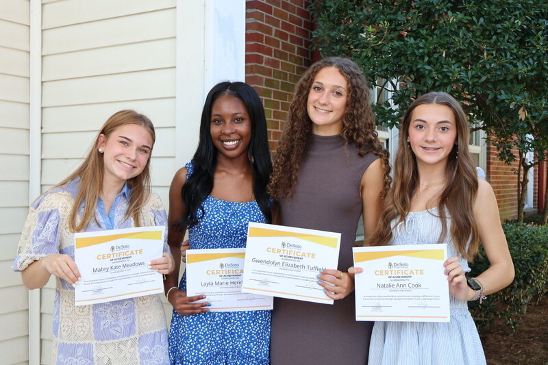 4 students pictured