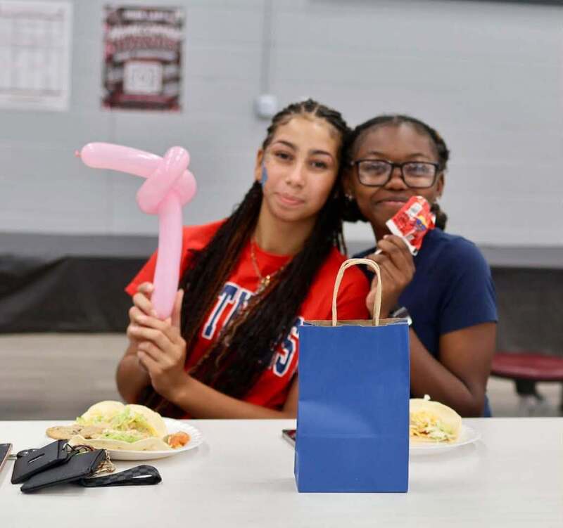 2 students with balloons
