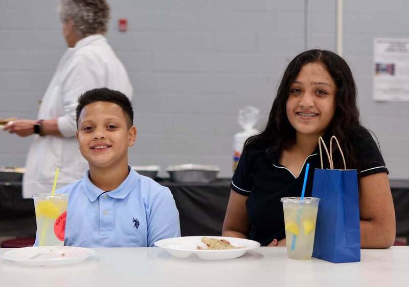 student with mom at table