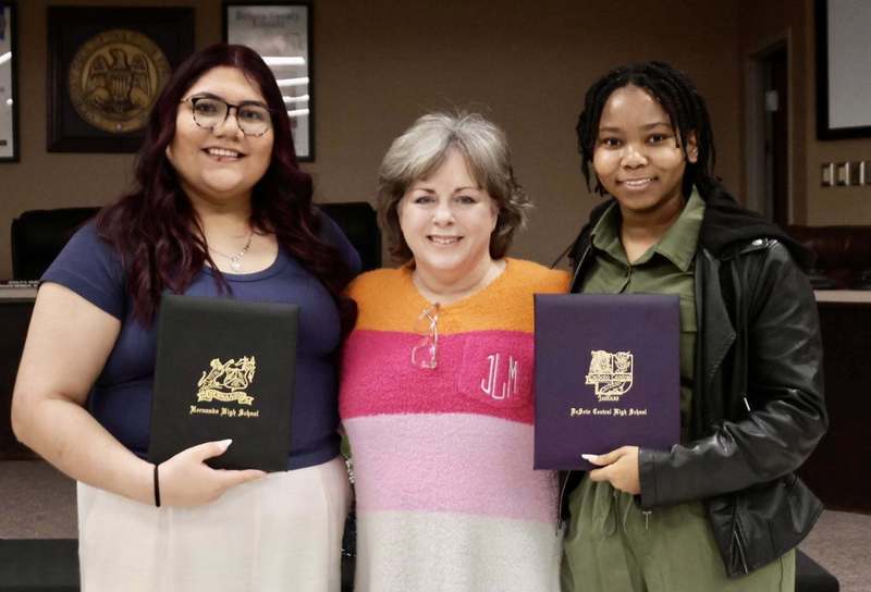 Mrs. Love with her students Itzel (Priscila) Aragonez and Mya Gaston