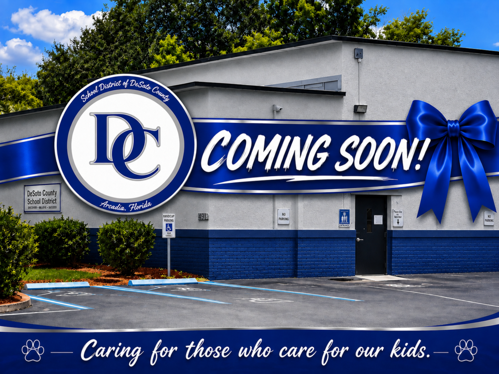 grey and blue buidling with DC logo and "Coming Soon" with a bow