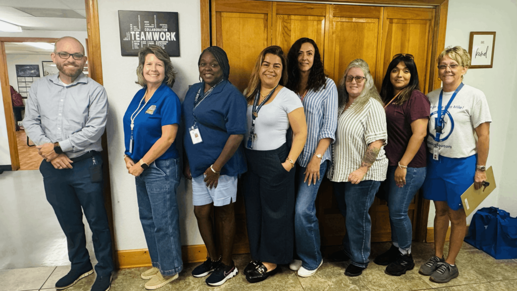 group of transportation staff smiling for a picture