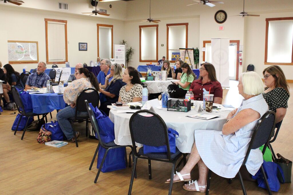 photo of group of educators watching a presentation