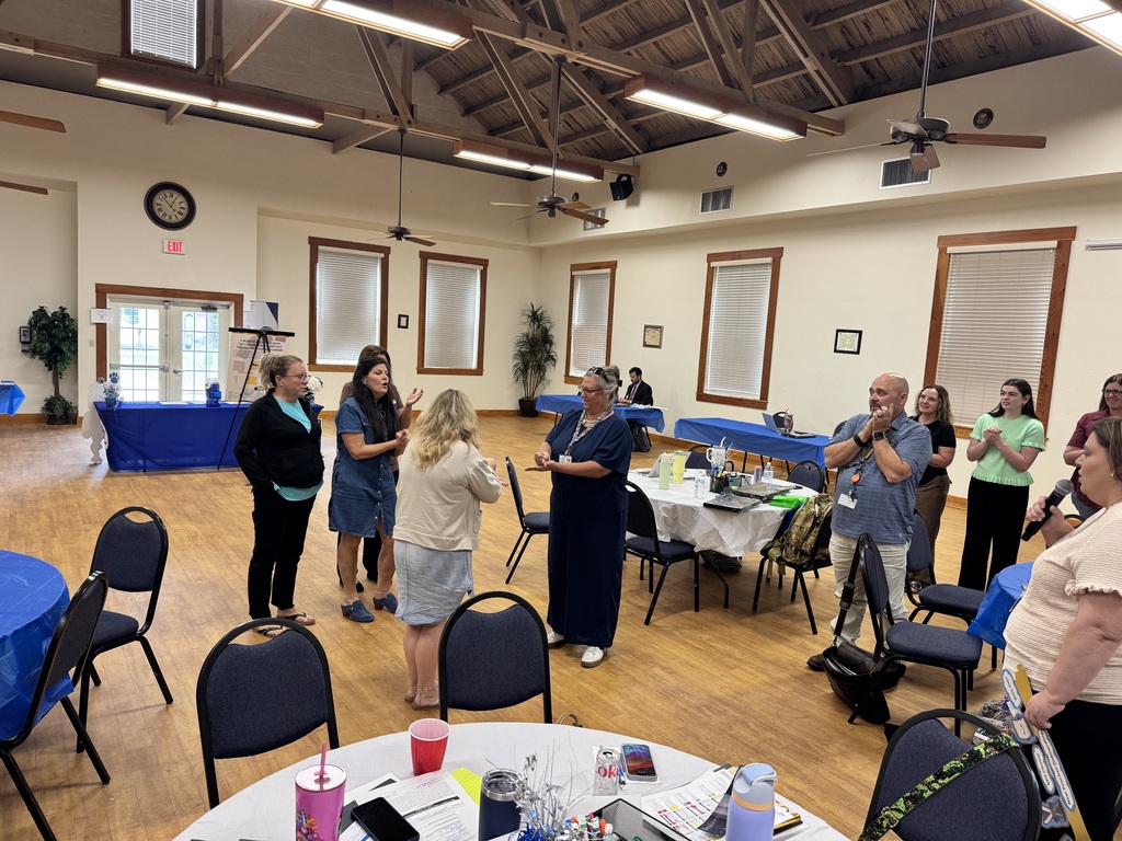 group of educators standing doing an activity